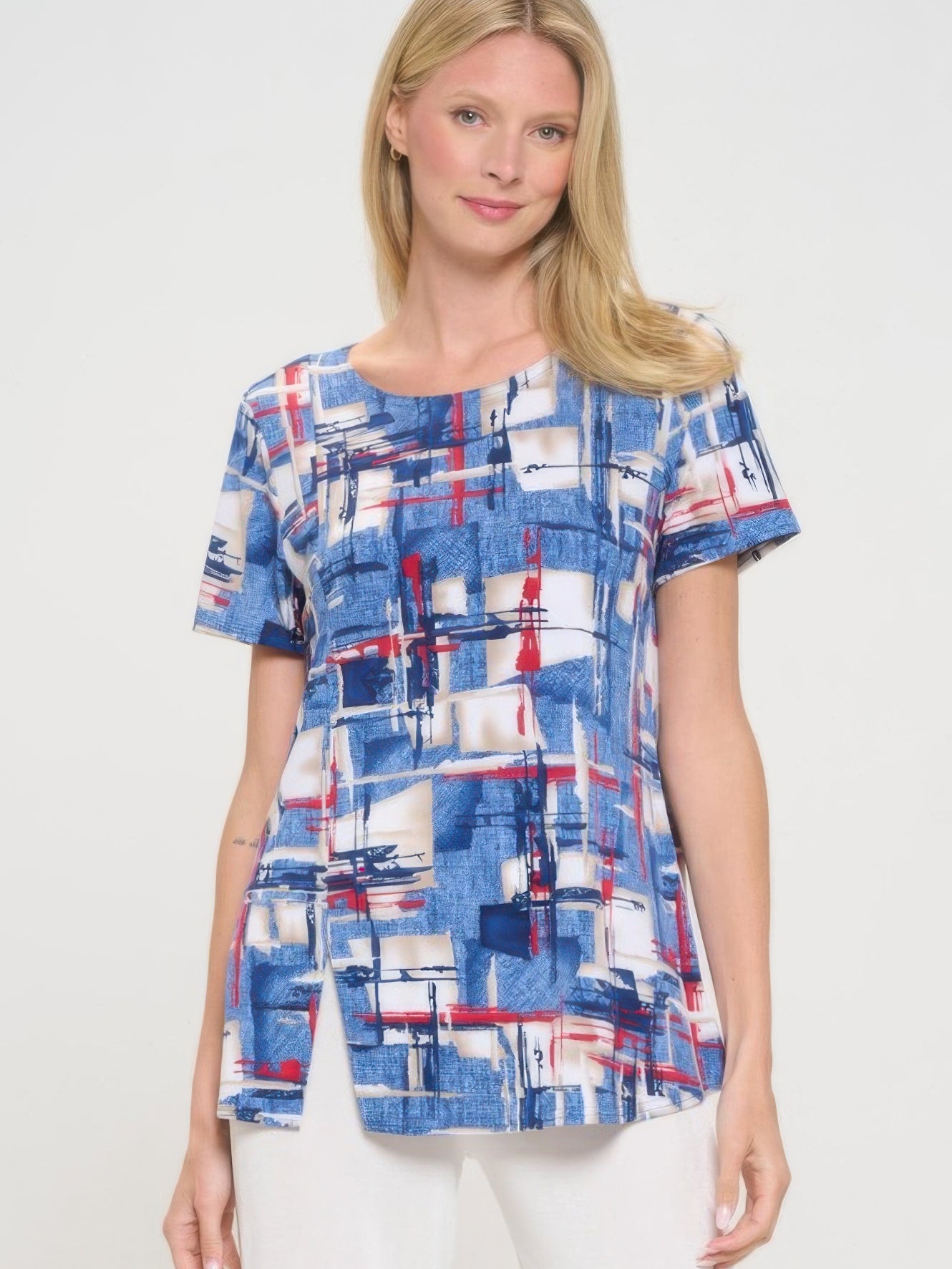 Stylish HIT round neck short sleeve top featuring a colorful abstract pattern and flattering silhouette.