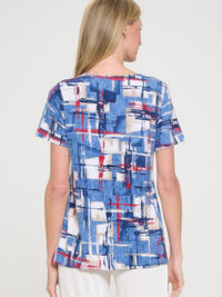 Back view of HIT Round Neck Short Sleeve Slit Top showcasing blue and red abstract design.