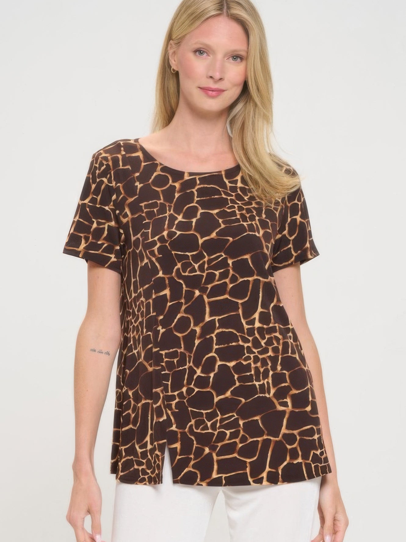 Short Sleeve Slit Top in giraffe print, showcasing a round neck and stylish side slits for a modern look.