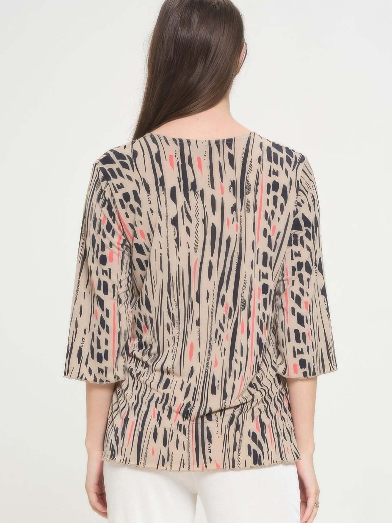 Back view of the Print Hit Merrow Top featuring a stylish pattern and comfortable fit.