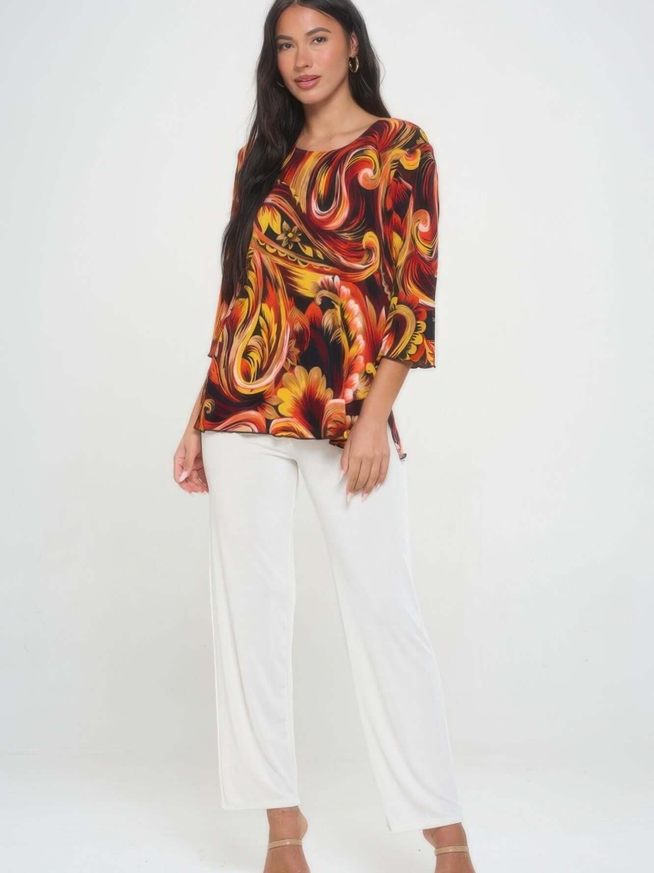 Print Quarter Sleeve Top featuring a colorful swirl design, paired with white pants, perfect for stylish casual wear.