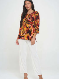 Print Quarter Sleeve Top featuring a colorful swirl design, paired with white pants, perfect for stylish casual wear.