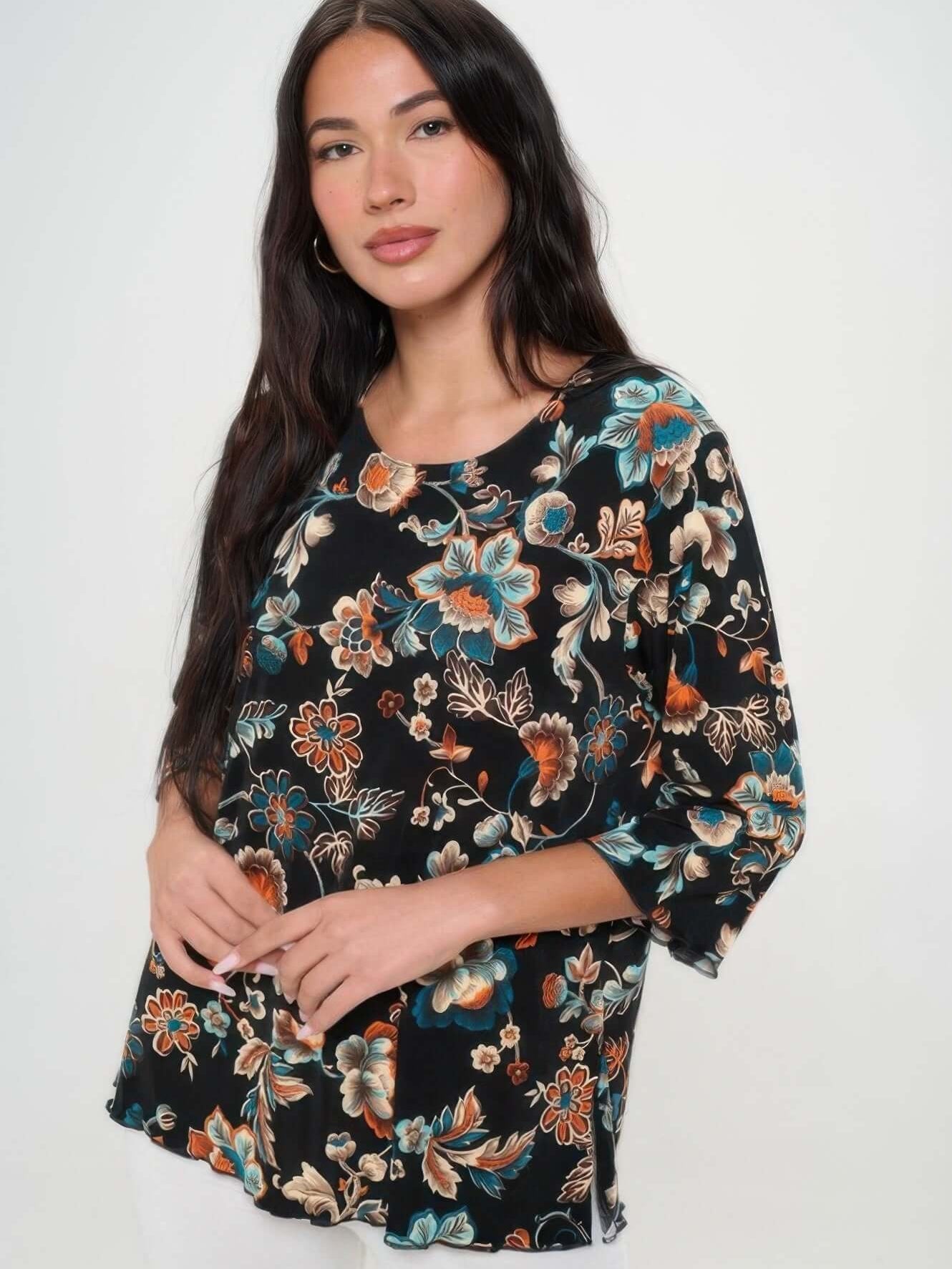Woman wearing a stylish print quarter sleeve top with floral design, featuring quarter sleeves and a flattering fit.