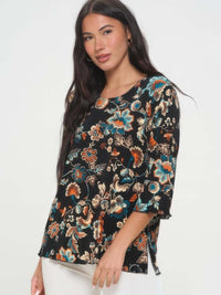 Print Quarter Sleeve Top featuring a stylish floral pattern and quarter sleeves on a model.