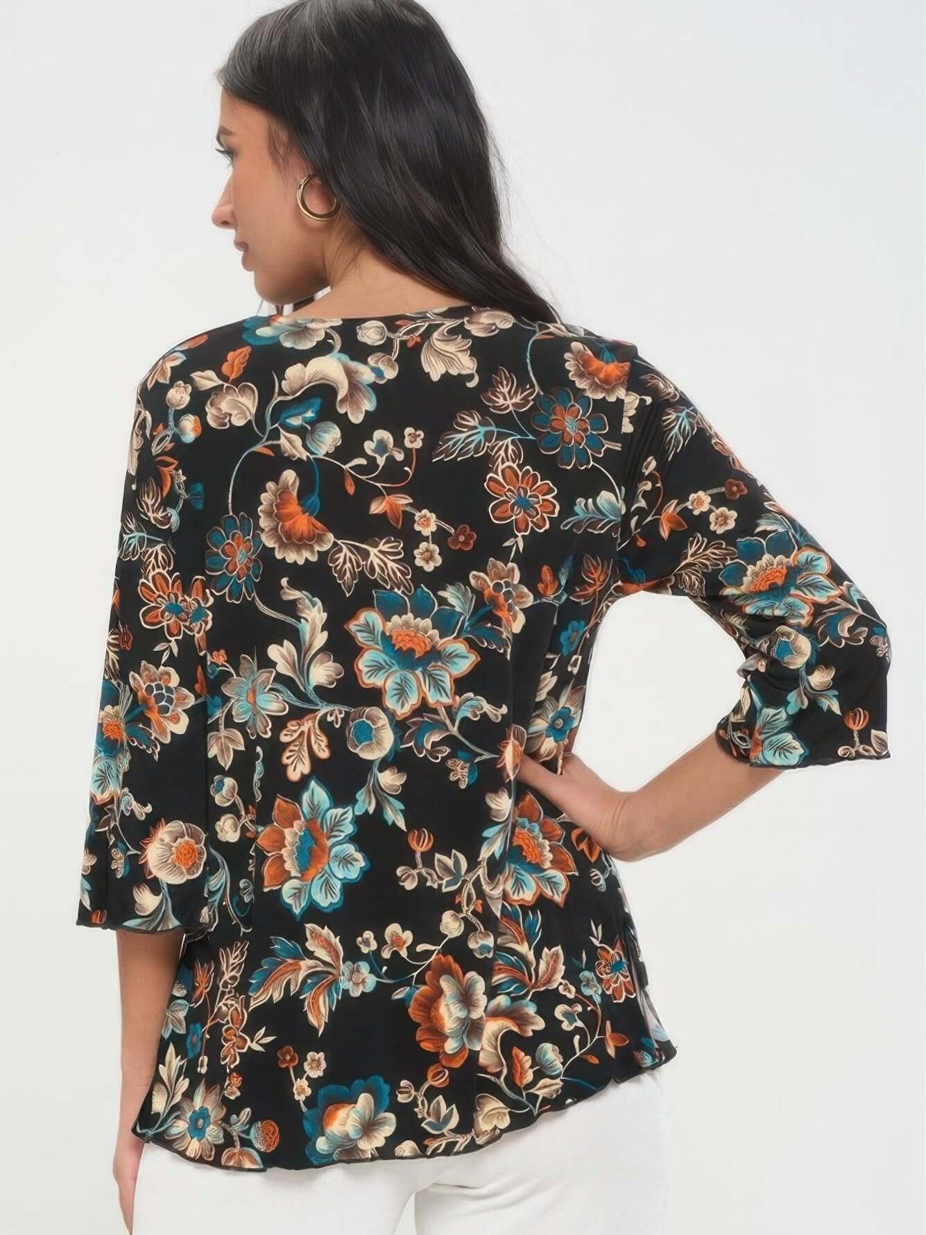 Back view of a woman wearing a floral Print Quarter Sleeve Top in black with colorful accents.