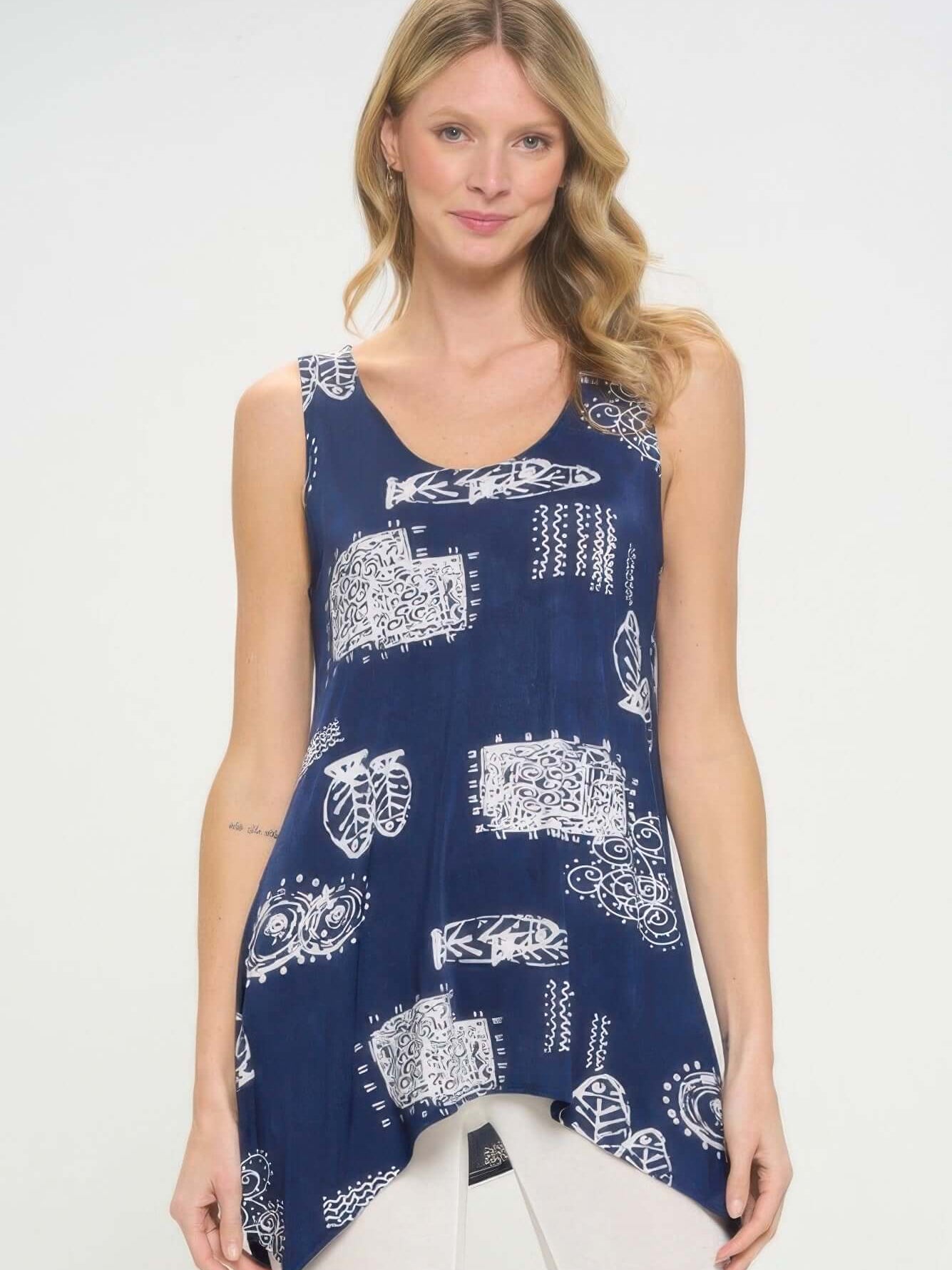 Model wearing a stylish shark bite hem tank top with a vibrant HIT print design in navy and white.