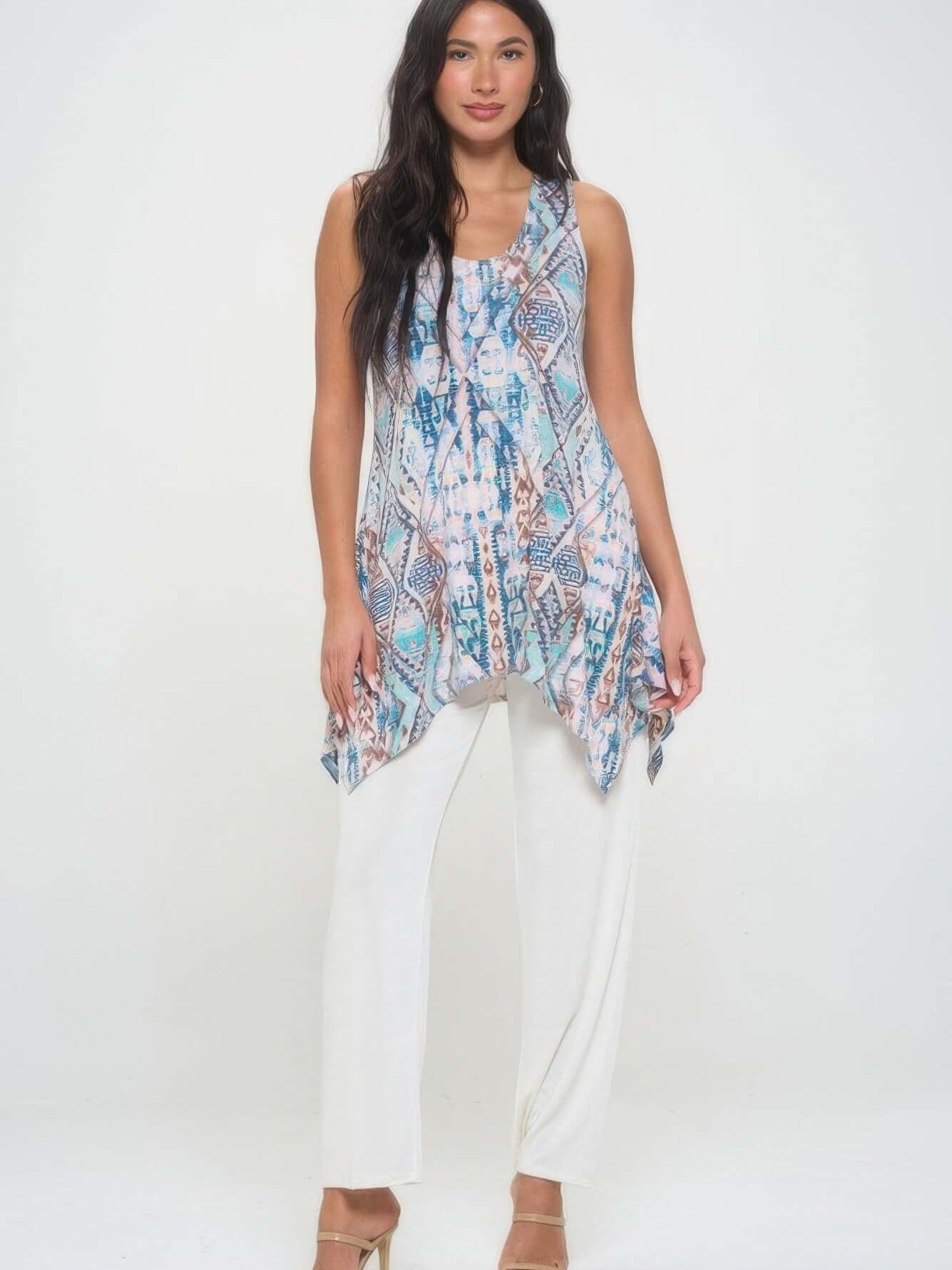 Shark Bite Hem Tank Top - Hit Print featuring a stylish asymmetrical hem and vibrant print, paired with white pants.