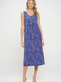 A model showcasing the BNS Print Long Tank Dress with a colorful floral pattern and a sleeveless design.