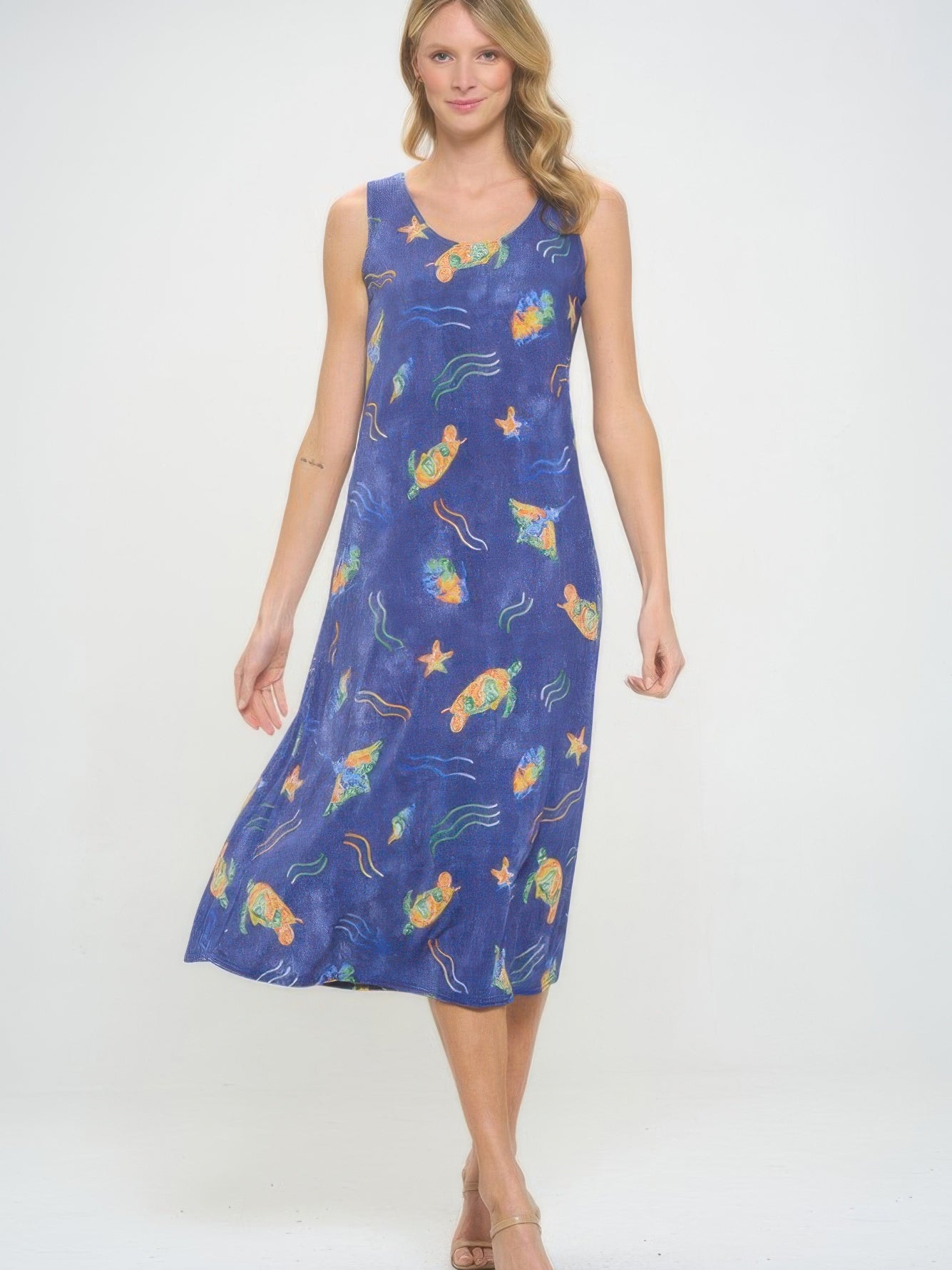 Model wearing a BNS Print Long Tank Dress featuring a vibrant sea life pattern on a blue background.