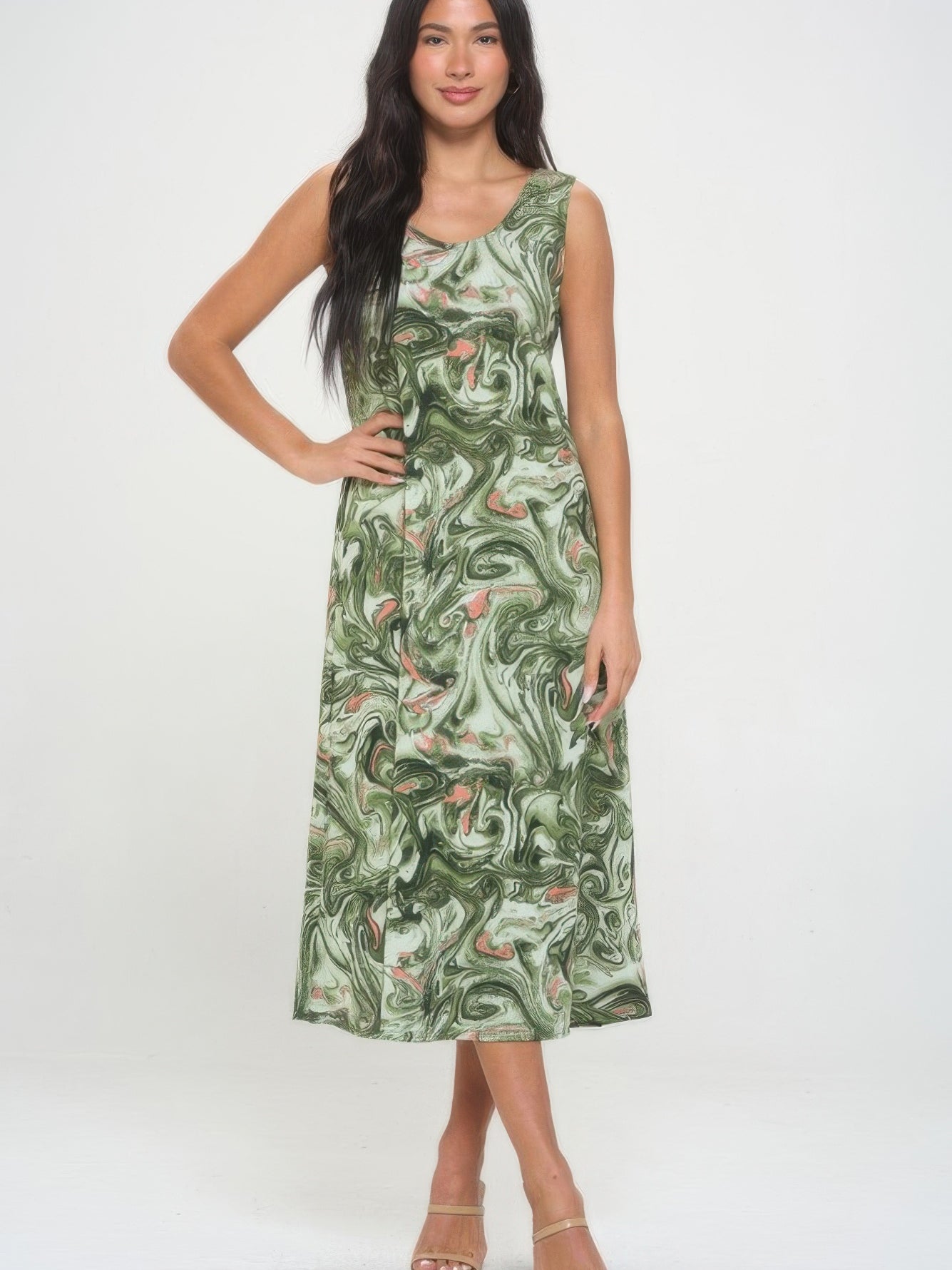 Model wearing a green printed long tank dress with a swirl pattern, showcasing a comfortable and stylish design.
