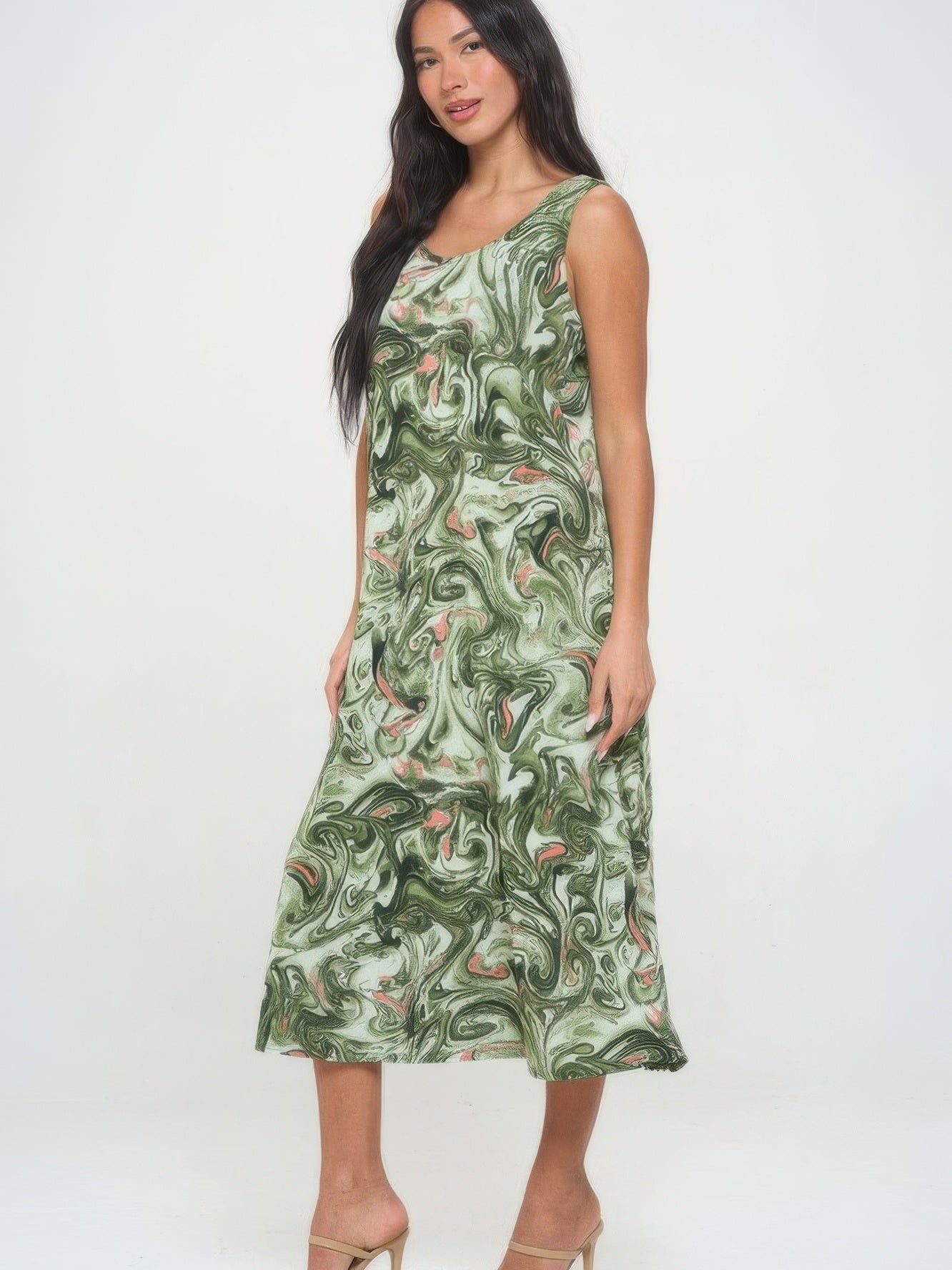 Model wearing a Bns Print Long Tank Dress, showcasing a green printed long tank dress with a stylish swirl pattern.