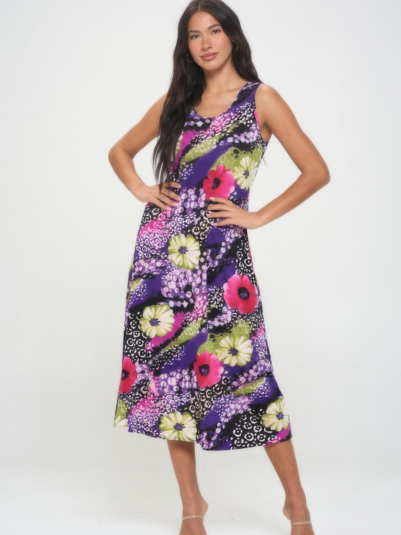 Model wearing a vibrant floral Bns print long tank dress, showcasing its flowing design and casual elegance.