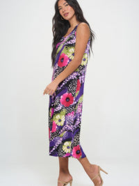 Model wearing a colorful Bns Print long tank dress, showcasing a vibrant floral pattern and casual style.
