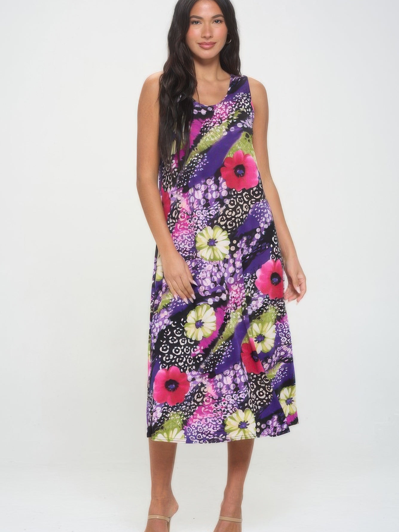 Model wearing a vibrant Bns Print long tank dress with floral patterns and flowing design.