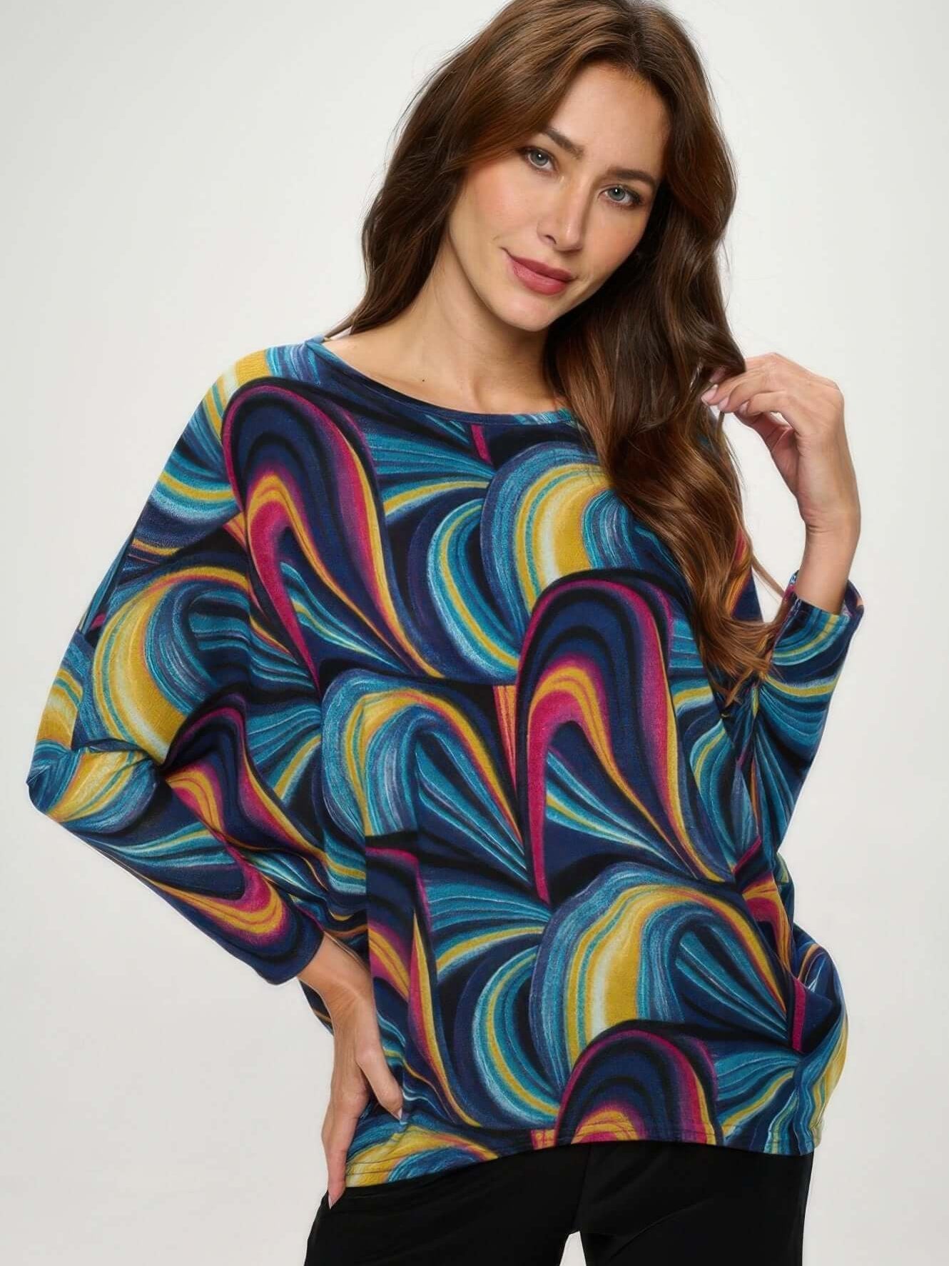 Mir batwing dolman top in vibrant swirl pattern, featuring relaxed fit and wide dolman sleeves for a flattering look.