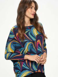 Mir batwing dolman top in colorful abstract design, showcasing relaxed fit and flowing sleeves, ideal for women's casual wear.