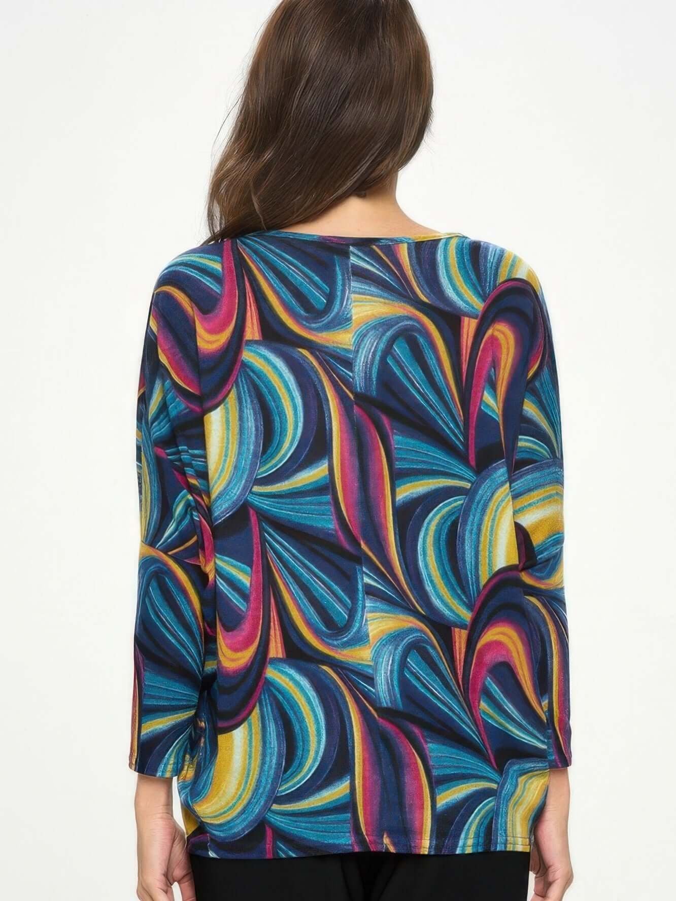 Back view of the Mir batwing dolman top with colorful abstract pattern, showcasing its relaxed fit and stylish design.