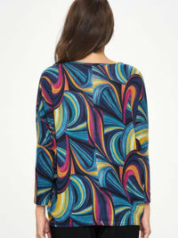 Back view of the Mir batwing dolman top with colorful abstract pattern, showcasing its relaxed fit and stylish design.
