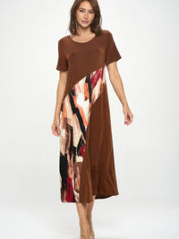 Model wearing the BNS Contrast Maxi Dress featuring a stylish blend of prints and solids in a full-length, elegant design.