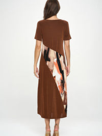 Back view of the BNS Contrast Maxi Dress showcasing its bold print and solid color design.