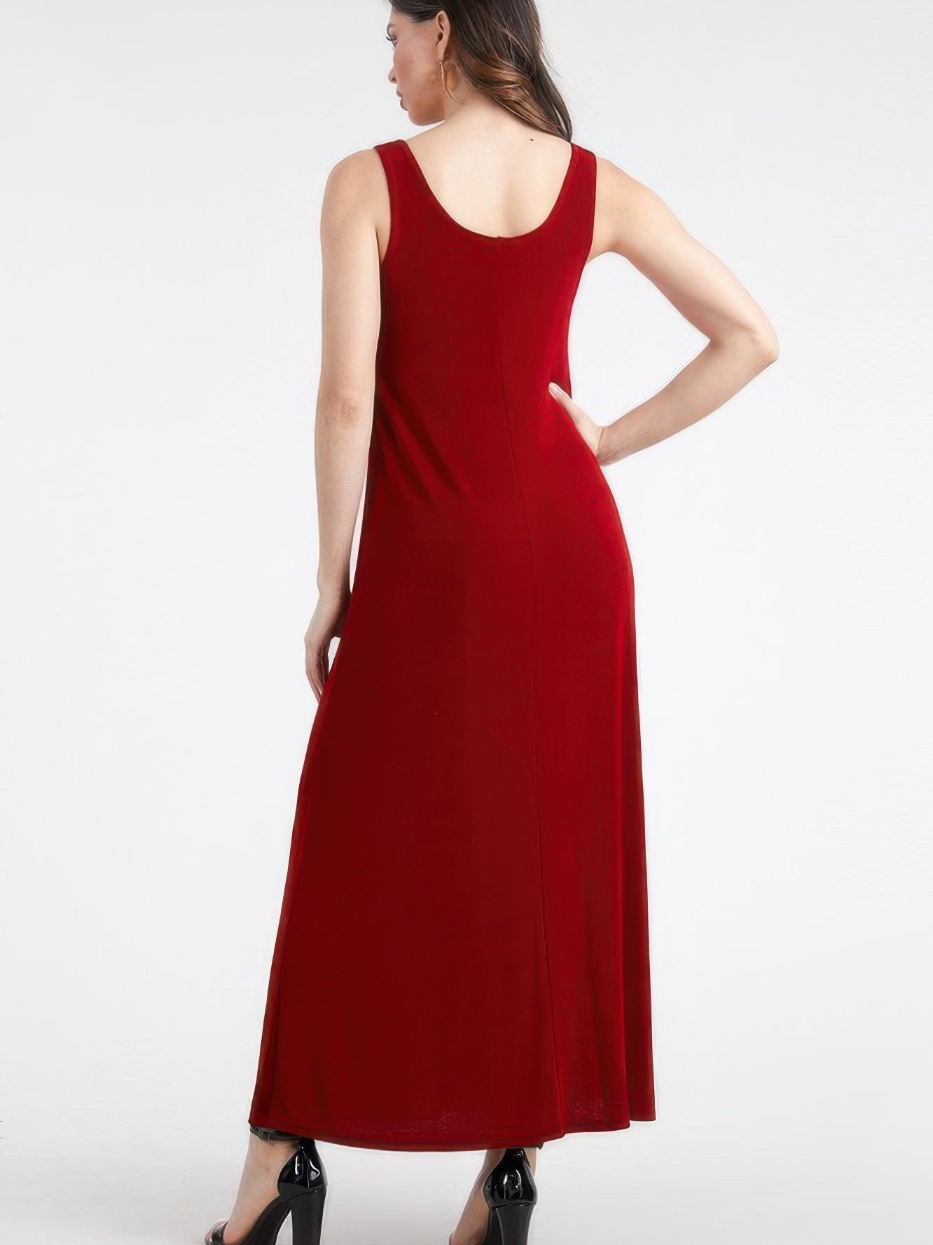 Model showcasing a plus size sleeveless maxi dress in red from the back, highlighting its elegant full-length silhouette.