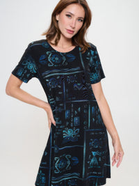 Plus size printed missy dress with short sleeves and a stylish print on a model against a plain background.