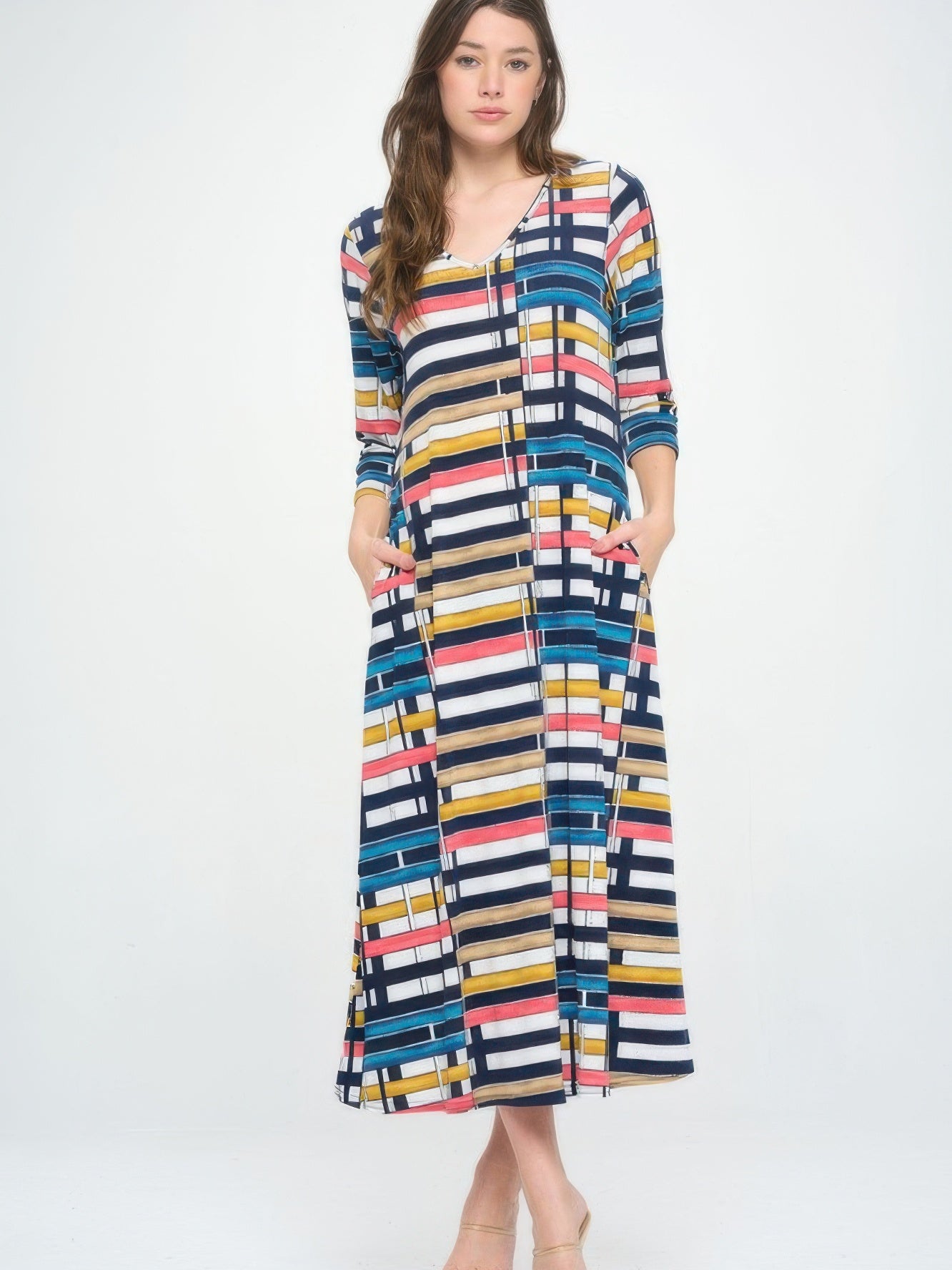 Hit V-neck long dress with pocket in a colorful striped pattern, featuring a fluid silhouette and stylish design.