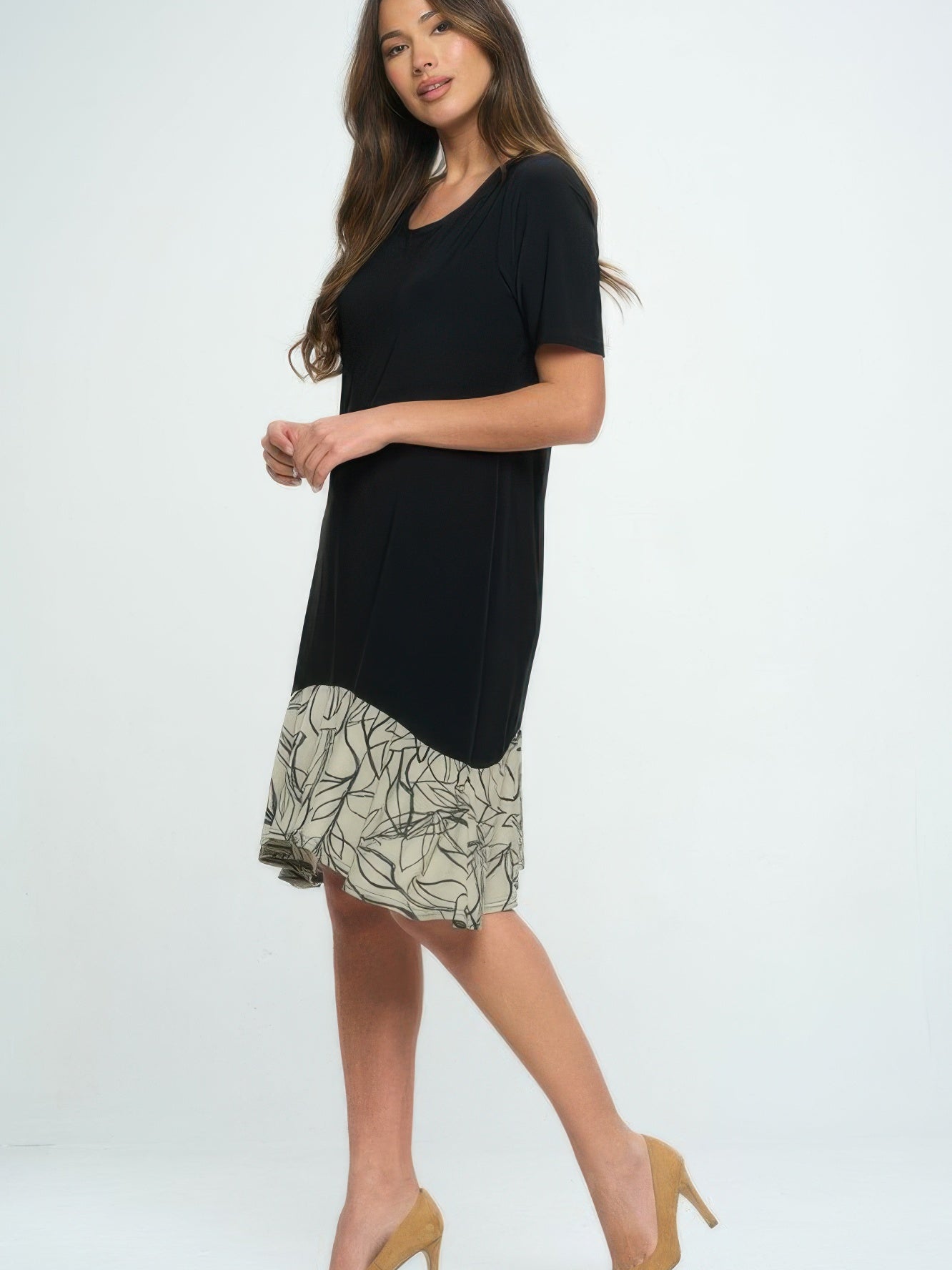 Model wearing a half sleeve contrast dress featuring a black top and a patterned skirt.