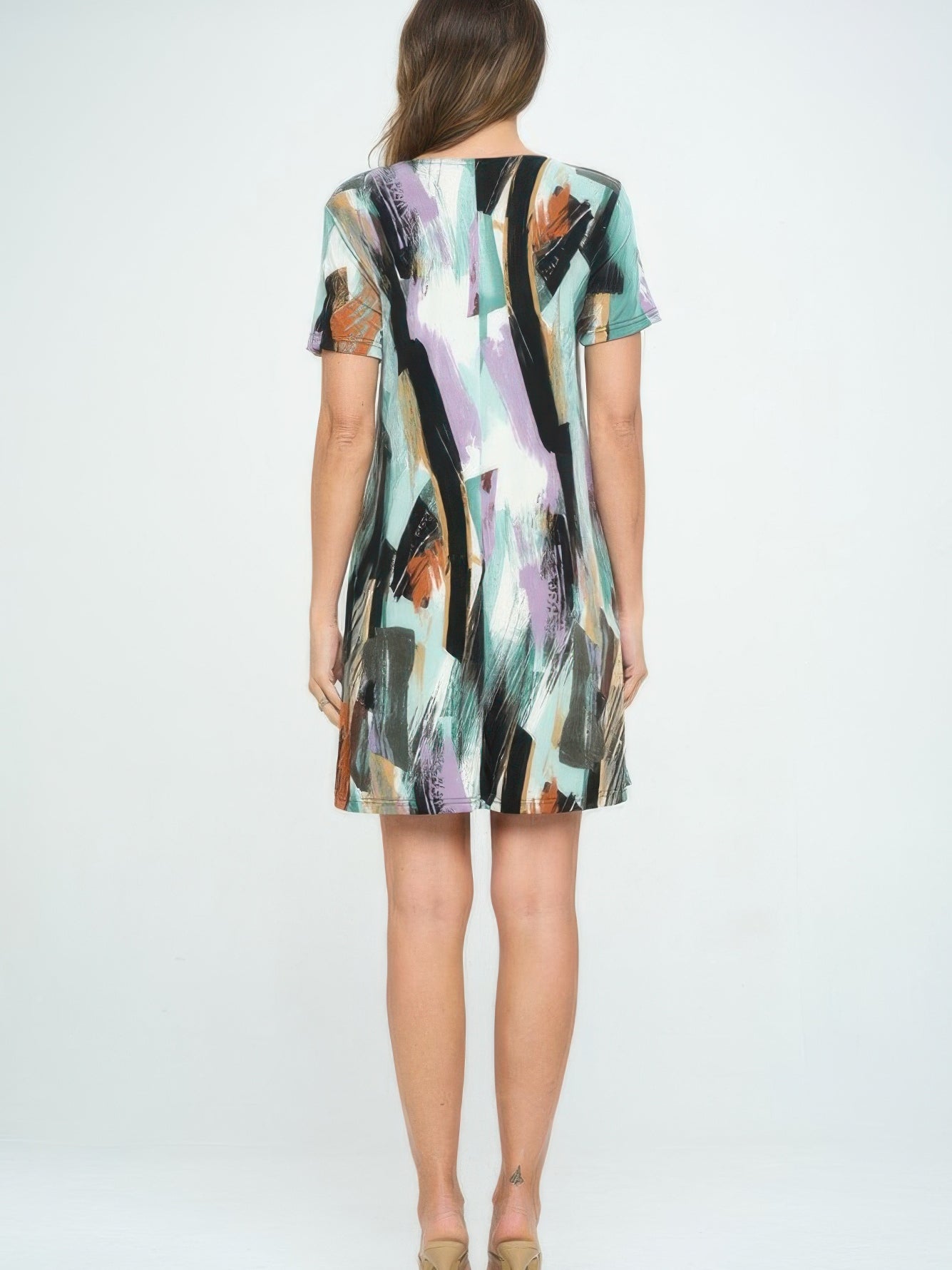 Back view of a stylish Short-Sleeved Knee-Length Dress featuring colorful brushstroke patterns.