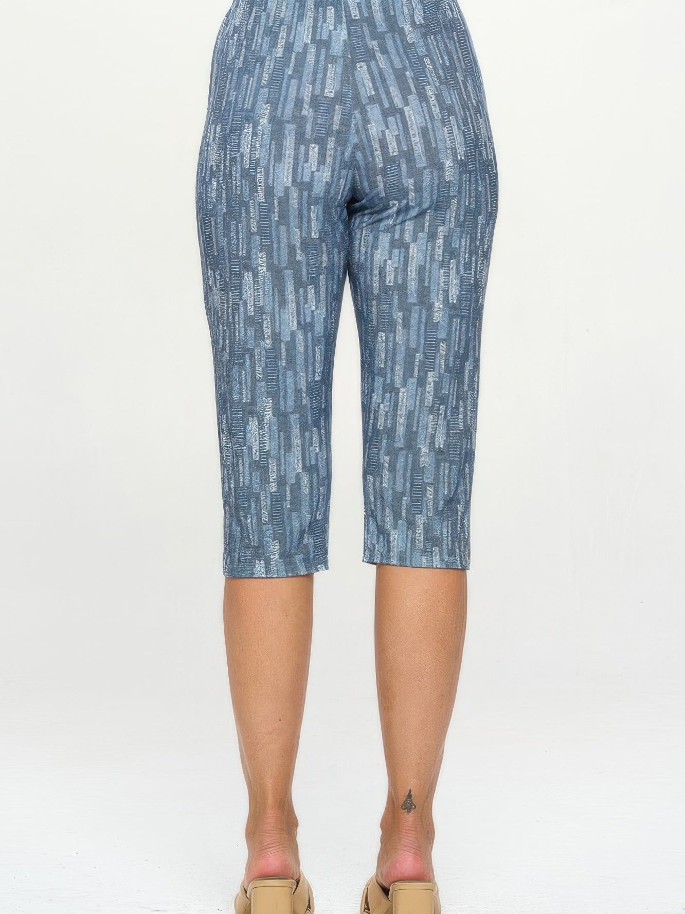 Comfortable capri pants in a stylish print, showcasing a flexible fit from the back view.
