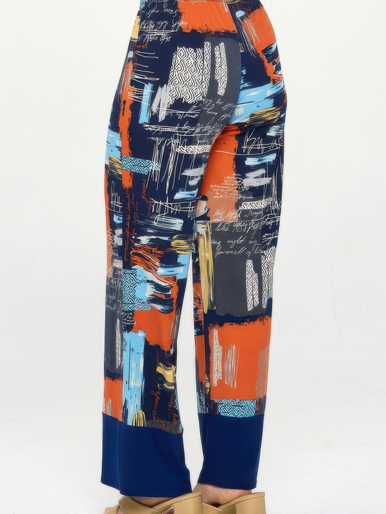 Colorful flared pants for women with vibrant prints and contrasting hem for a stylish, dramatic look.