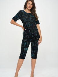 Model wearing Plus Size BNS Capri Pants Set featuring a printed top and matching capri pants.