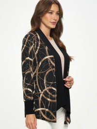 Glitter Long Sleeve Contrast Jacket worn by a woman, featuring a black base with gold shimmering details.