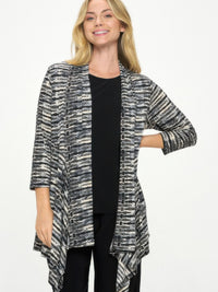 Model wearing the ITY Draped Wrap Jacket, featuring a soft drape front and dynamic printed design.