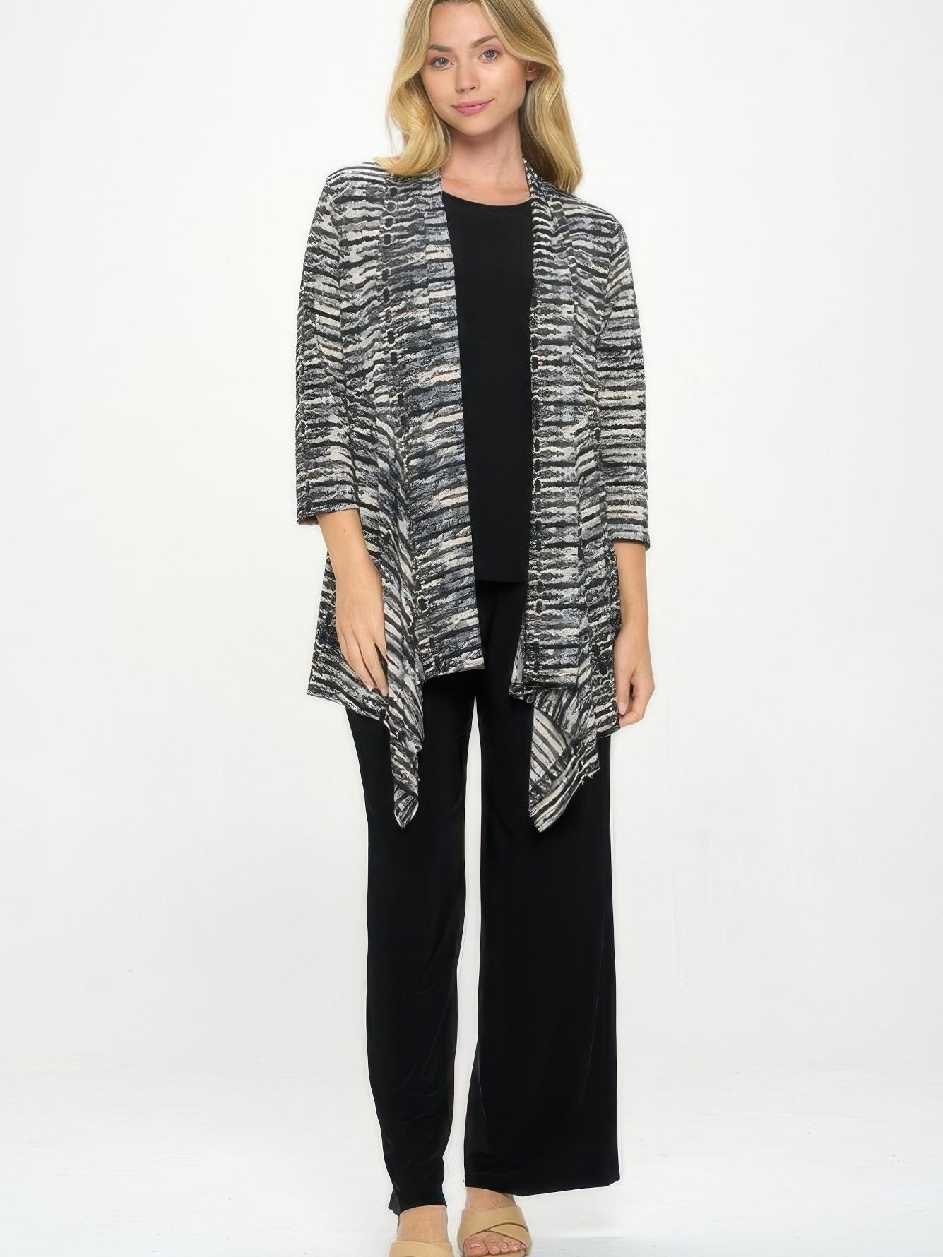 ITY Draped Wrap Jacket worn over a black top and black pants, featuring a stylish draped design and quarter sleeves.