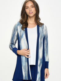 A model wearing the ITY Contrast Cardigan with long sleeves, featuring solid and print panels in a stylish design.