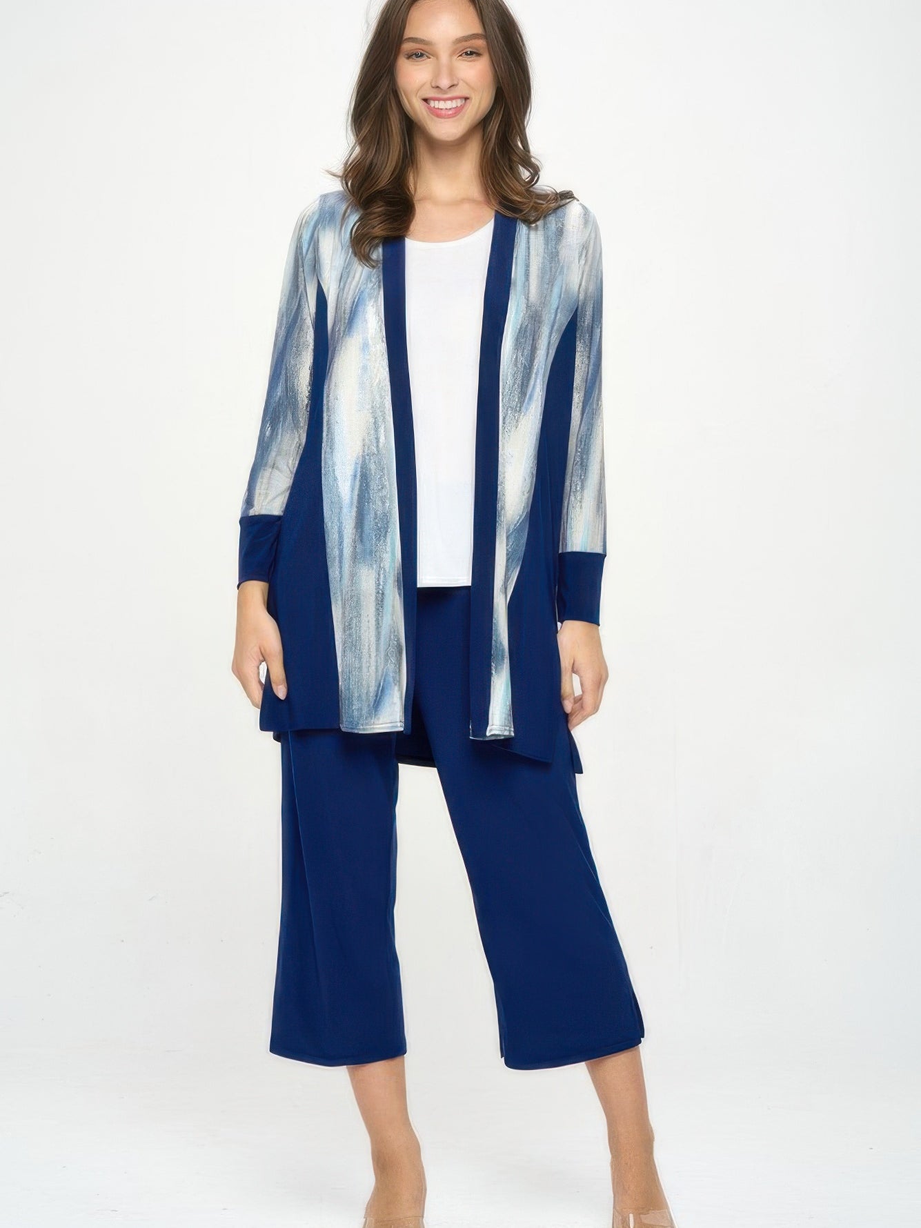 Model showcasing the ITY Contrast Cardigan with long sleeves and print panels, styled with navy pants.