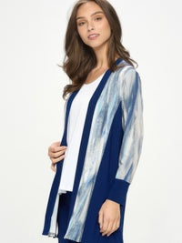Model wearing ITY Contrast Cardigan featuring long sleeves and a modern design in blue and white.