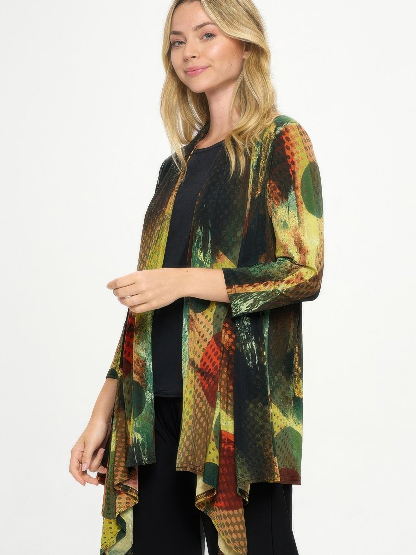 Model showcasing the ITY Draped Wrap Jacket with a colorful printed design and quarter sleeves.