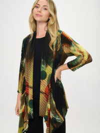 Stylish woman modeling the ITY Draped Wrap Jacket with a vibrant printed design and quarter sleeves.