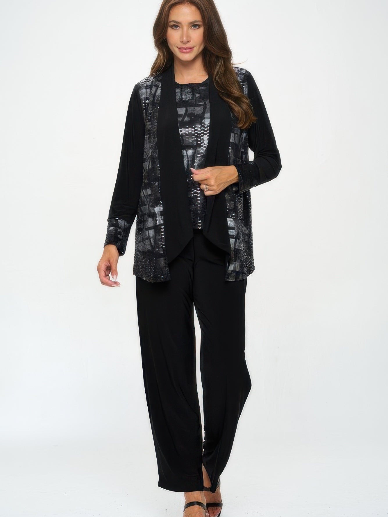 Model wearing a Nylon Foil Sequin Contrast Jacket with black pants and strappy heels, showcasing a chic and modern look.