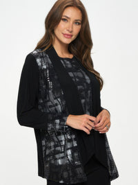 Woman wearing a Nylon Foil Sequin Contrast Jacket, showcasing a stylish black and metallic design.