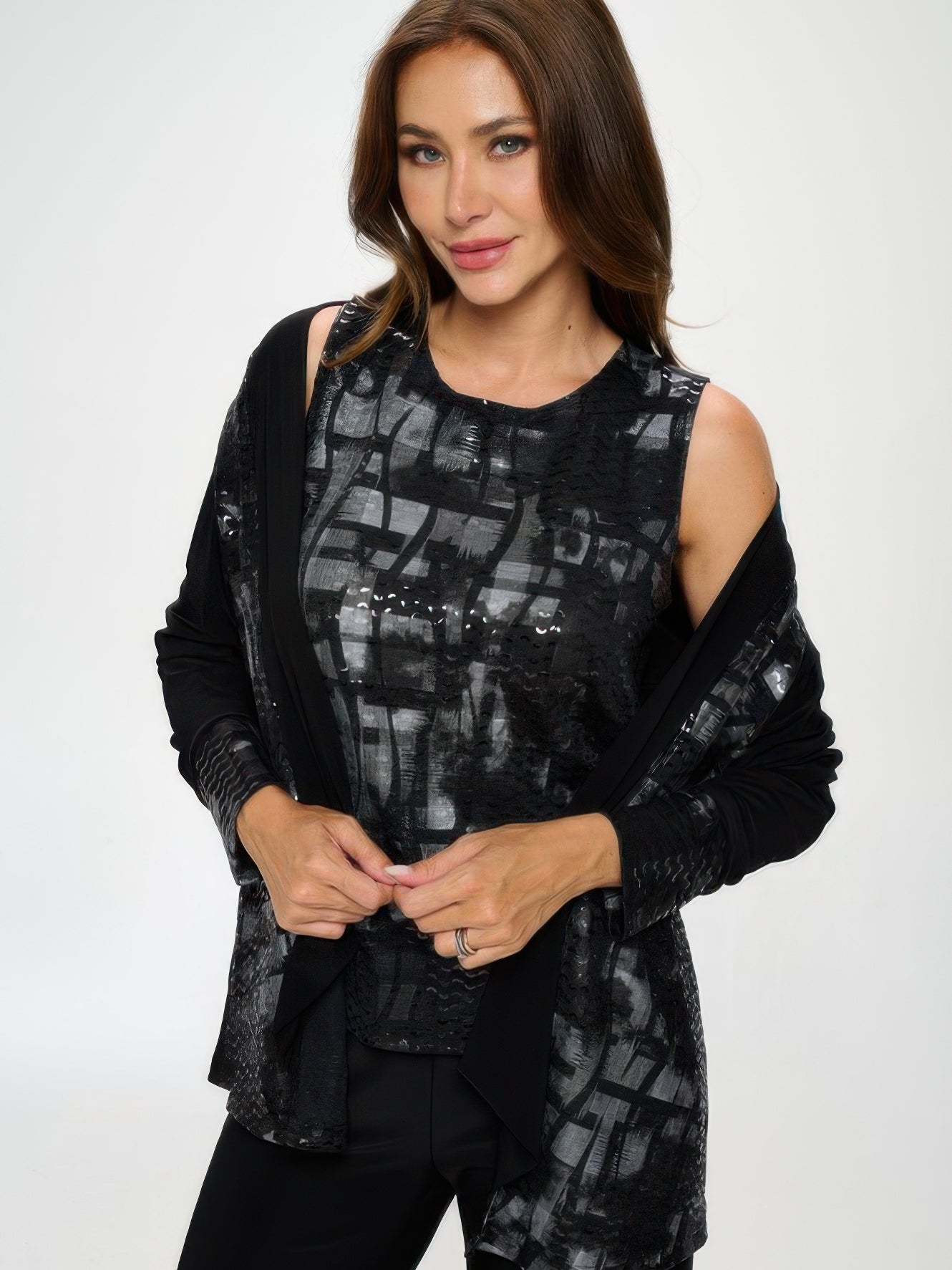 Woman modeling a Nylon Foil Sequin Contrast Jacket with a metallic foil front and black back panel.