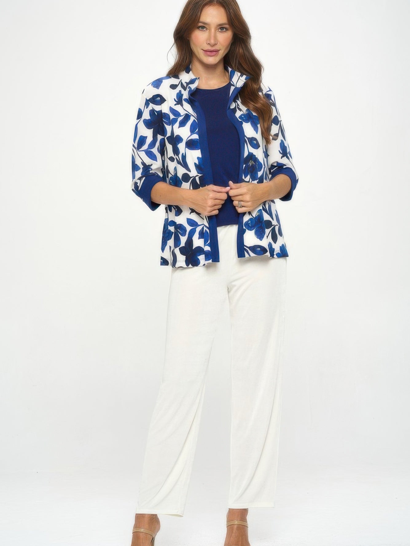 Model wearing Damboru Print Contrast Jacket with blue Magnolia print and mandarin collar, paired with white pants.