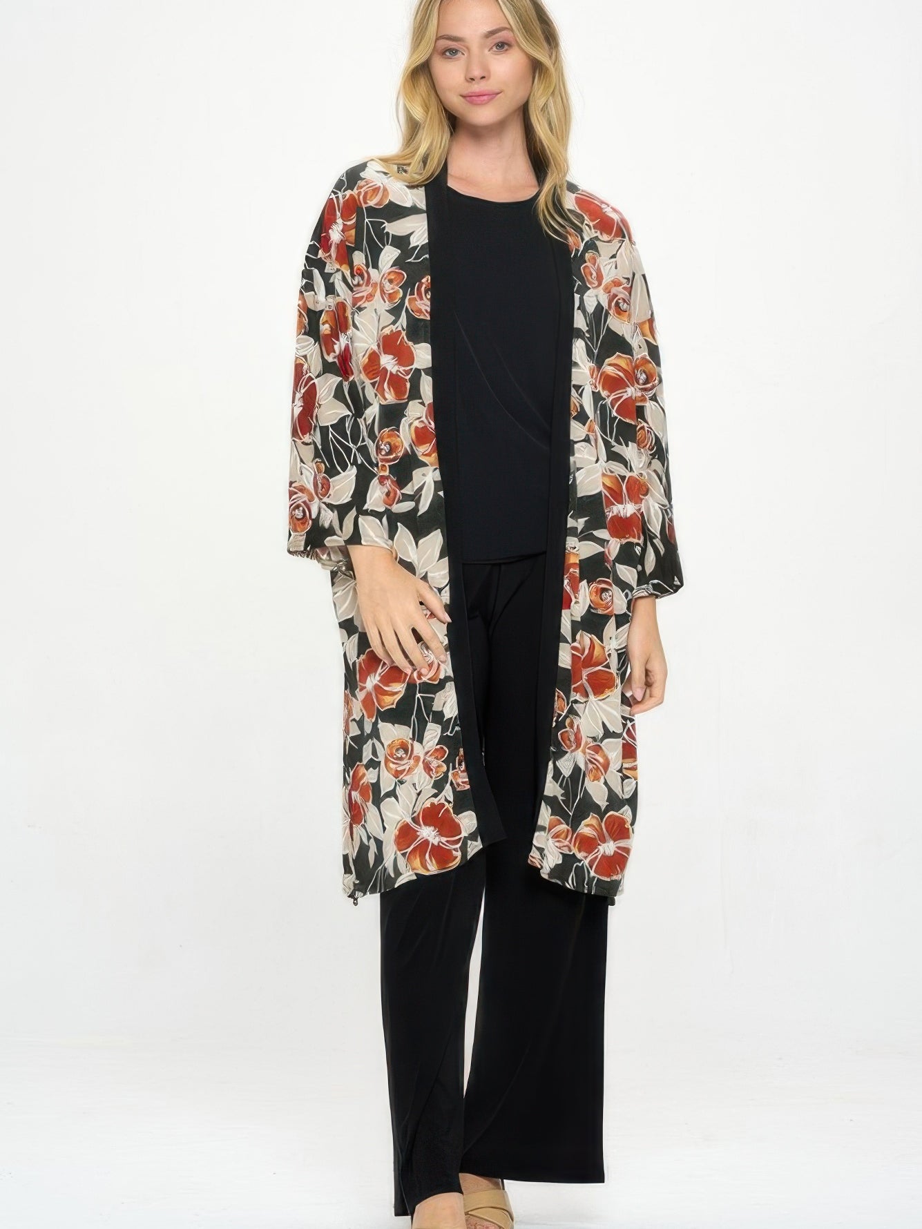 Hit Kimono Long Jacket With Pocket worn over a black outfit, featuring vibrant floral prints and side pockets.