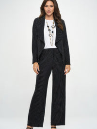 Ottoman Pinstripe Front Drape Jacket worn with a white top and statement necklace, showcasing its elegant design.