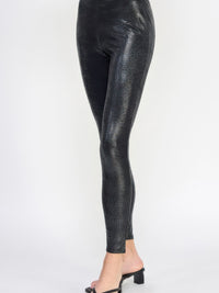 Snake Skin Print Leggings in sleek pleather-like finish, showcased on a model for a trendy fashion statement.