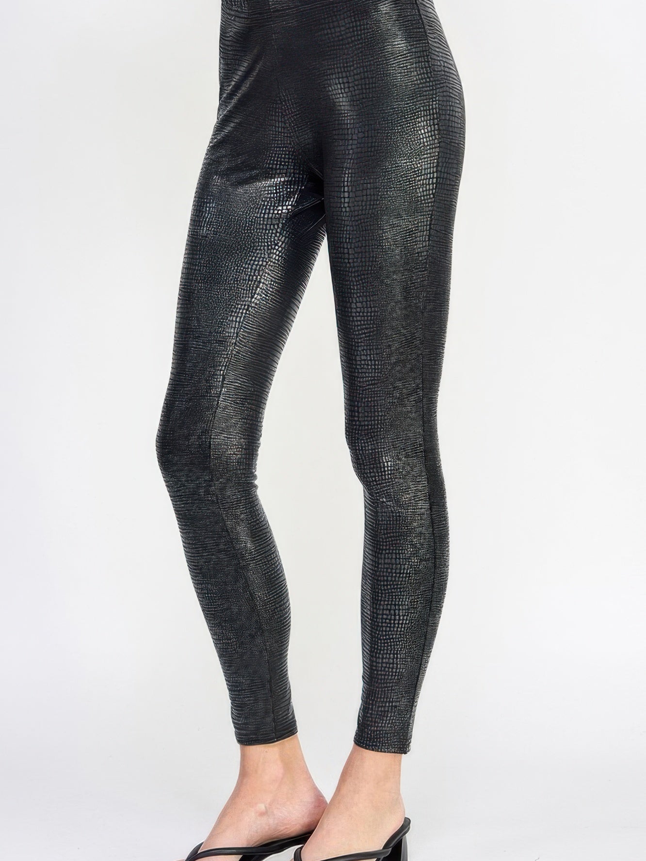 Snake Skin Print Leggings shown in a sleek pleather-like finish, perfect for a bold, stylish look.