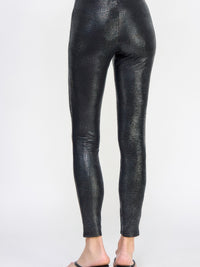 Snake Skin Print Leggings showcasing a sleek pleather-like finish from the back view, emphasizing a flattering fit.