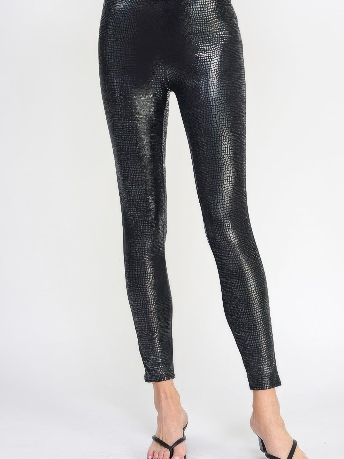 Snake Skin Print Leggings in a sleek black pleather-like finish for a stylish and flattering fit.